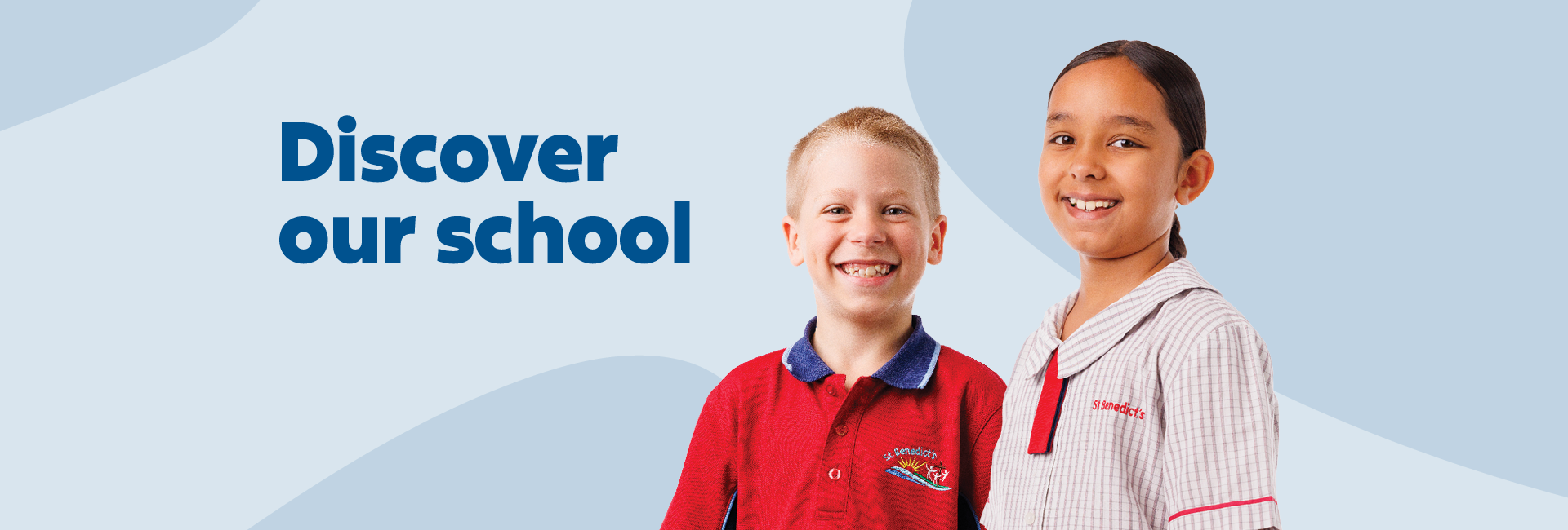 Two children smiling wearing school uniforms